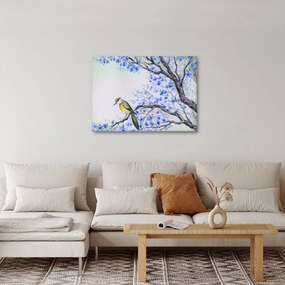Tablou - Pasăre pe un copac cu flori albastre (70x50 cm)