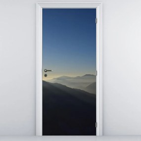 Fototapet pentru ușă - Desupra crestelor montane (95x205cm)