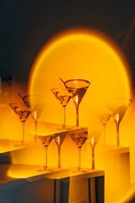 Fotografie Kaleidoscope martini cocktail in orange neon, Nitas