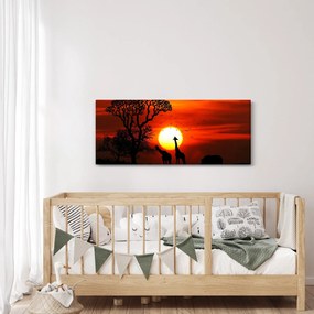 Tablou - Siluete animalelor la apus de soare (120x50 cm)