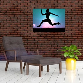 Tablou pe sticlă cu silueta feminină sărind (70x50 cm)
