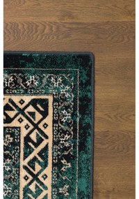 Covor în culoarea petrolului din lână 133x180 cm Mia – Agnella