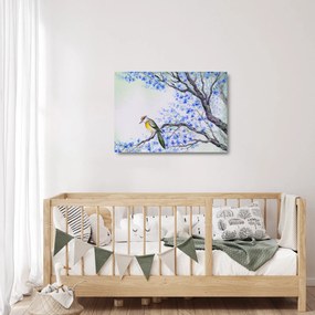 Tablou pe sticlă - Pasăre pe un copac cu flori albastre (70x50 cm)