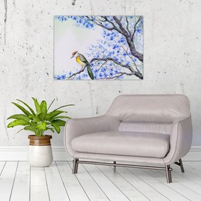 Tablou pe sticlă - Pasăre pe un copac cu flori albastre (70x50 cm)