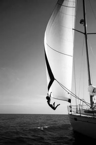 Fotografie Woman jumping from a yacht into the ocean., Mint Images