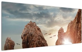 Tablou - Apus de soare peste stânci (120x50 cm)