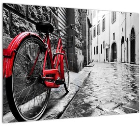 Tablou pe sticlă - Bicicleta roșie pe o stradă pavată (70x50 cm)