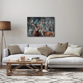 Tablou pe sticlă - Cerb și căprioare în pădurea înzăpezită (70x50 cm)