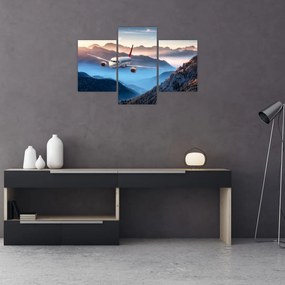 Tablou - Avion peste crestele montane (90x60 cm)