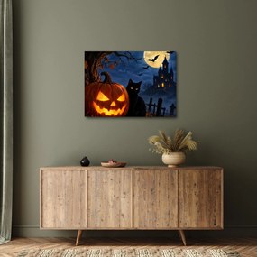 Tablou - Pisică neagră lângă un dovleac luminat de Halloween (70x50 cm)