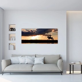Tablou - Rider pe un cal la apus de soare (120x50 cm)