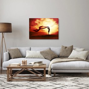 Tablou pe sticlă - Silueta femeii la apus de soare (70x50 cm)