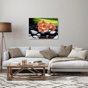 Tablou pe sticlă - Orhidee portocalie cu frunze de palmier (70x50 cm)