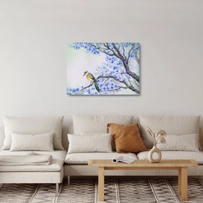 Tablou pe sticlă - Pasăre pe un copac cu flori albastre (70x50 cm)