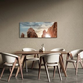 Tablou - Apus de soare peste stânci (120x50 cm)