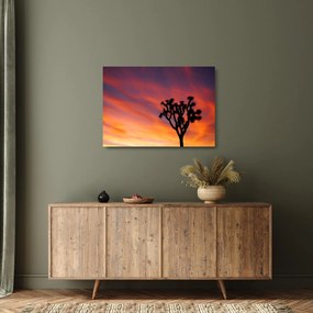 Tablou pe sticlă apus de soare deasupra siluetei unui copac (70x50 cm)