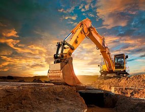 Ilustrație Excavator at a construction site against, Avalon_Studio