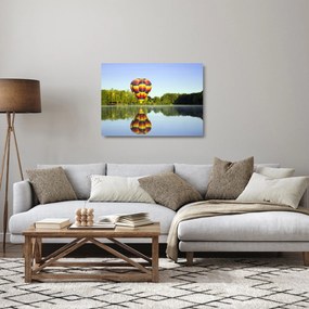 Tablou pe sticlă cu balon cu aer cald pe un lac (70x50 cm)