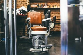 Fotografie Stylish Vintage Barber Chair In brick, stefanamer