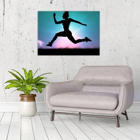 Tablou pe sticlă cu silueta feminină sărind (70x50 cm)