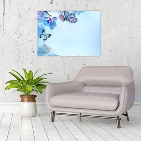 Tablou pe sticlă - Fluture pe flori de orhidee, albastru (70x50 cm)