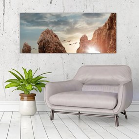Tablou - Apus de soare peste stânci (120x50 cm)