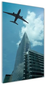 Tablou Printat Pe Sticlă Avionul deasupra orașului