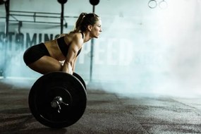 Fotografie Side view of athletic woman exercising, skynesher