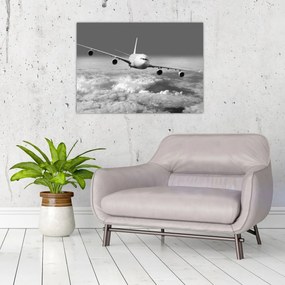 Tablou pe sticlă - Avion în nori, alb și negru (70x50 cm)