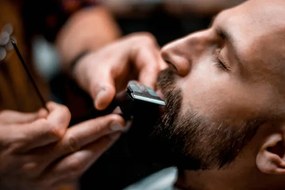 Fotografie Man getting his mustache shaped by, EXTREME-PHOTOGRAPHER