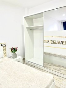 Dormitor Palermo, culoare alb, cu pat tapitat 160 x 200 cm, dulap cu 2 usi, comoda cu oglinda, 2 noptiere