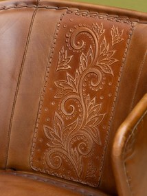Scaun dining din piele naturală, maro, cu spătar curbat, motive florale gravate și picioare negre din metal, 75 x 49 x 61 cm, „Arabesque”