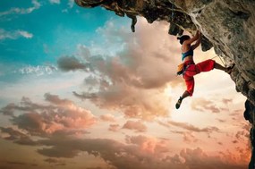 Fotografie Athletic Woman climbing on overhanging cliff, Solovyova