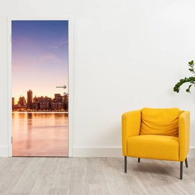 Fototapet pentru ușă - Oraș la apus de soare (95x205cm)