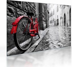 Tablou pe sticlă - Bicicleta roșie pe o stradă pavată (70x50 cm)