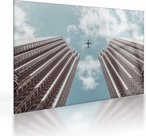 Tablou pe sticlă cuavion între clădiri (70x50 cm)