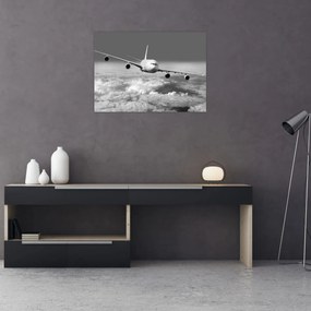 Tablou pe sticlă - Avion în nori, alb și negru (70x50 cm)