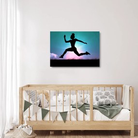 Tablou pe sticlă cu silueta feminină sărind (70x50 cm)